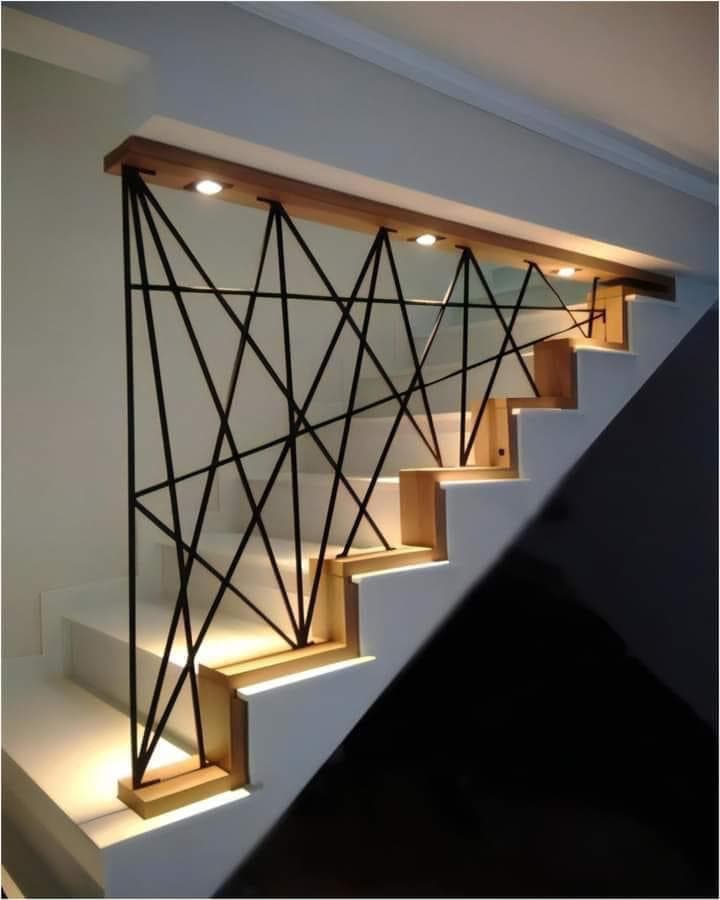 Custom staircase railing and mixed-material interior fabrication by St Marys Enterprises